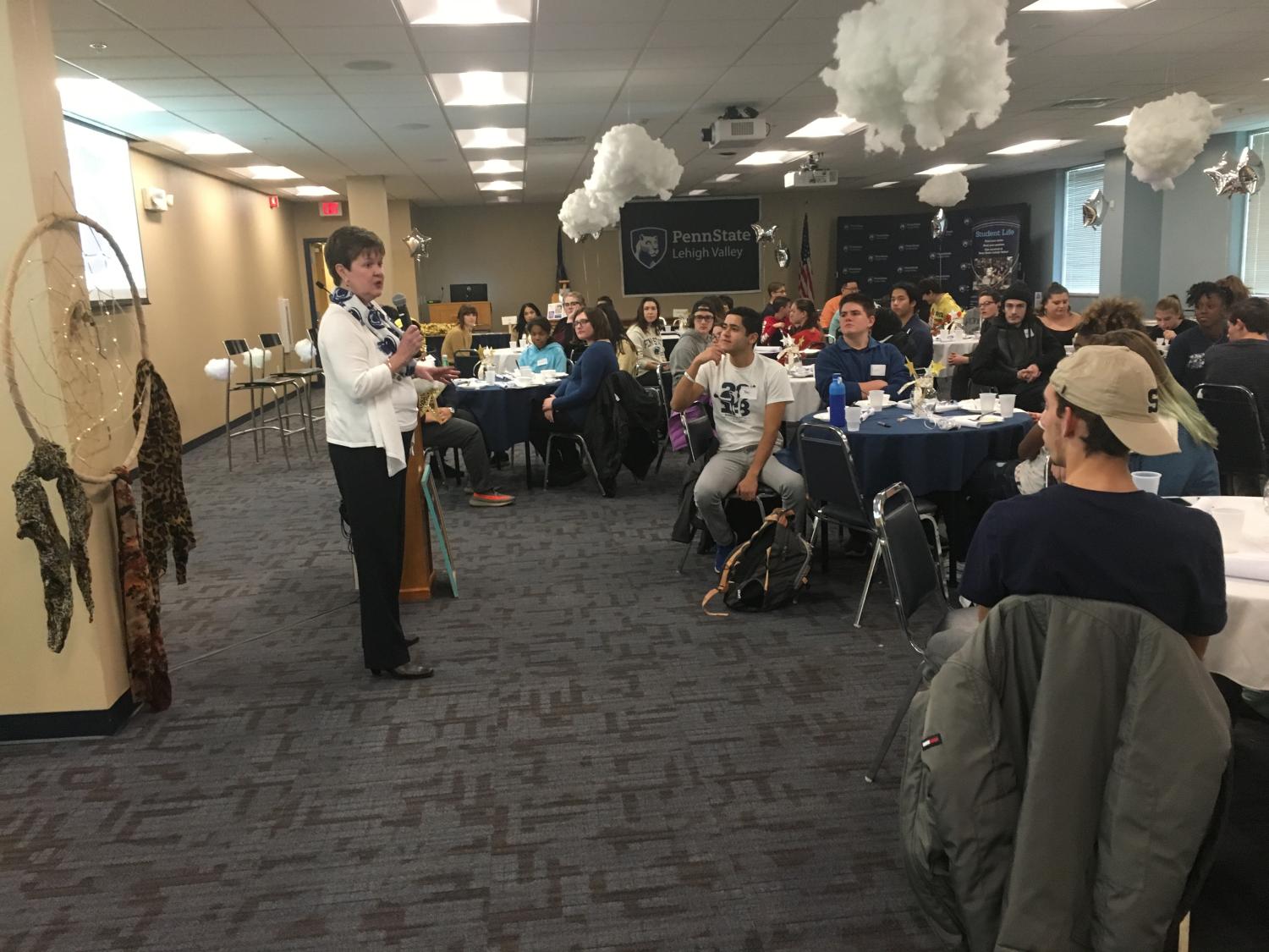 Professor presenting to a room full of students