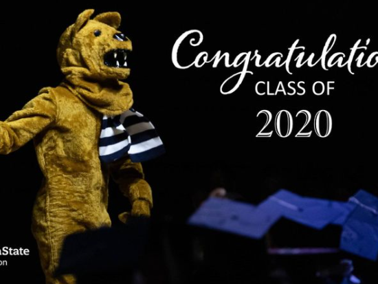 Nittany Lion in front of graduates in caps and gowns with "Congratulations Class of 2020"