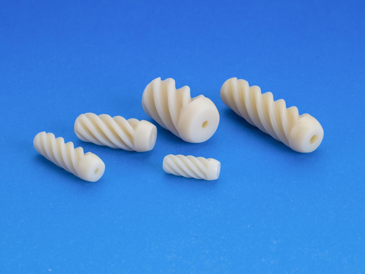 White screws lay on a blue background