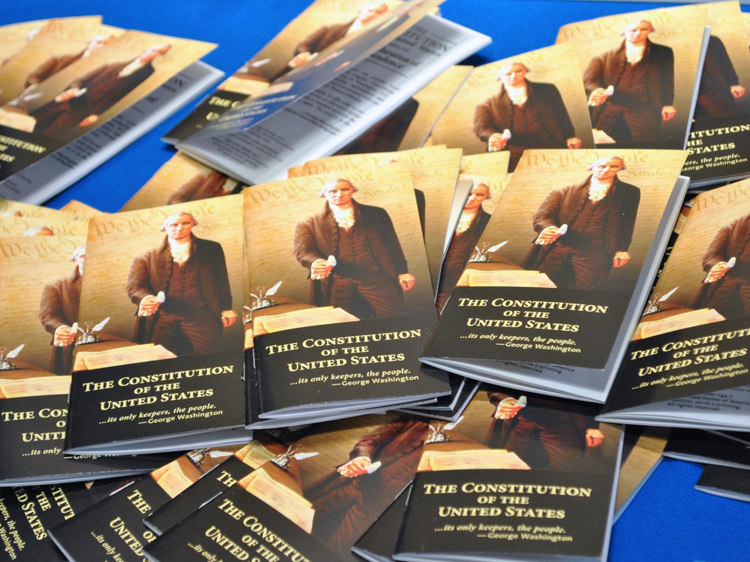 pile of mini Constitution books