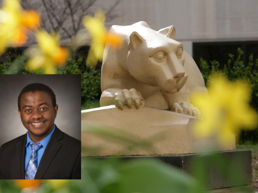A professional headshot of Dr. Paddy Ssentongo, superimposed over a photo of a Nittany Lion statue. The statue is surrounded by flowers, slightly out of focus.