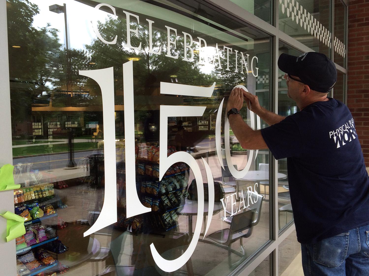 Man adds 150 celebration decal to Creamery window