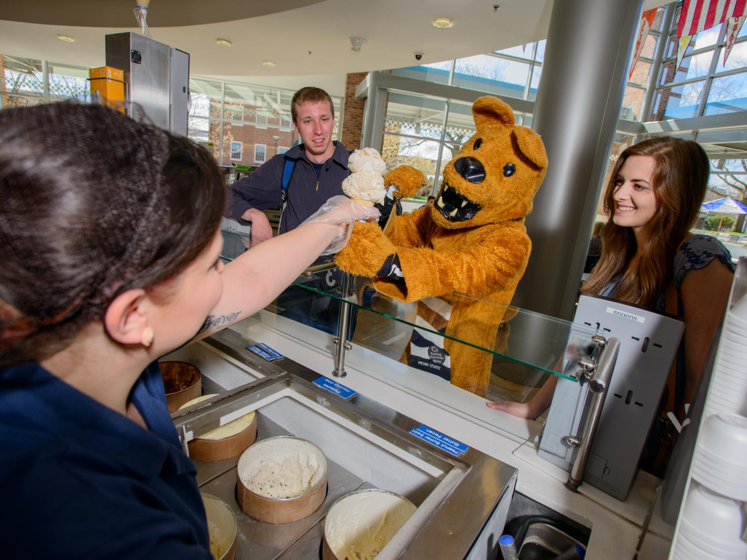 The Nittany Lion being served ice cream