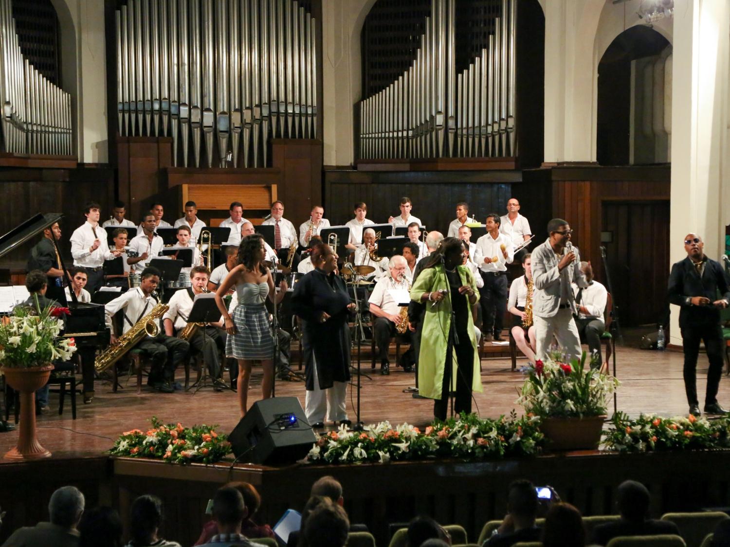 A Latin-jazz orchestra plays in a concert hall.