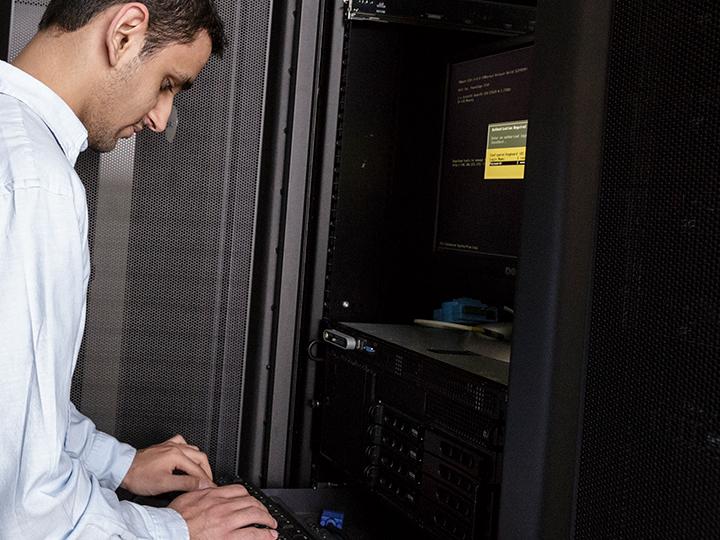 a Cybersecurity professor at one of the campus's computers