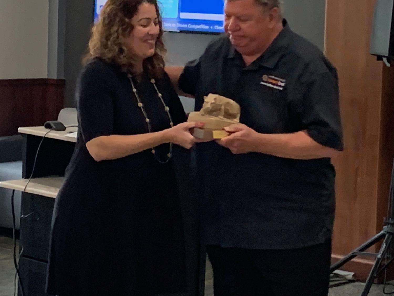 DEF President Kristen Vida recently presented Penn State DuBois Chancellor M. Scott McBride with a Nittany Lion statue recognizing his service to the campus. 