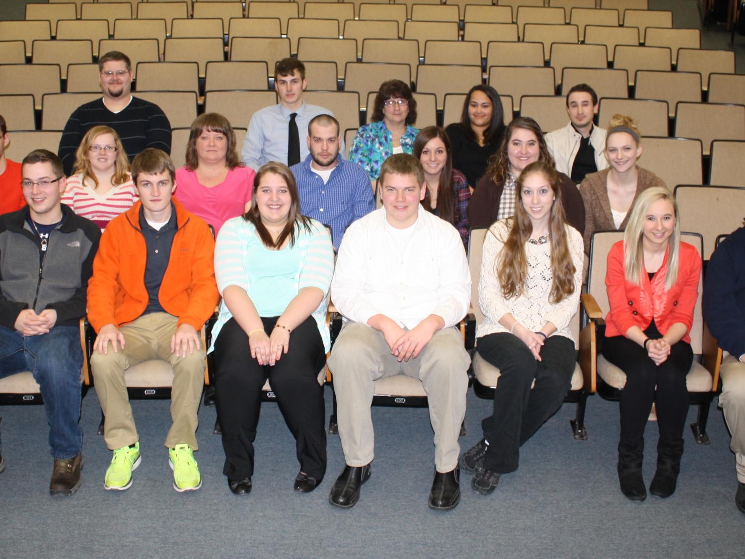New inductees posing with their adviser