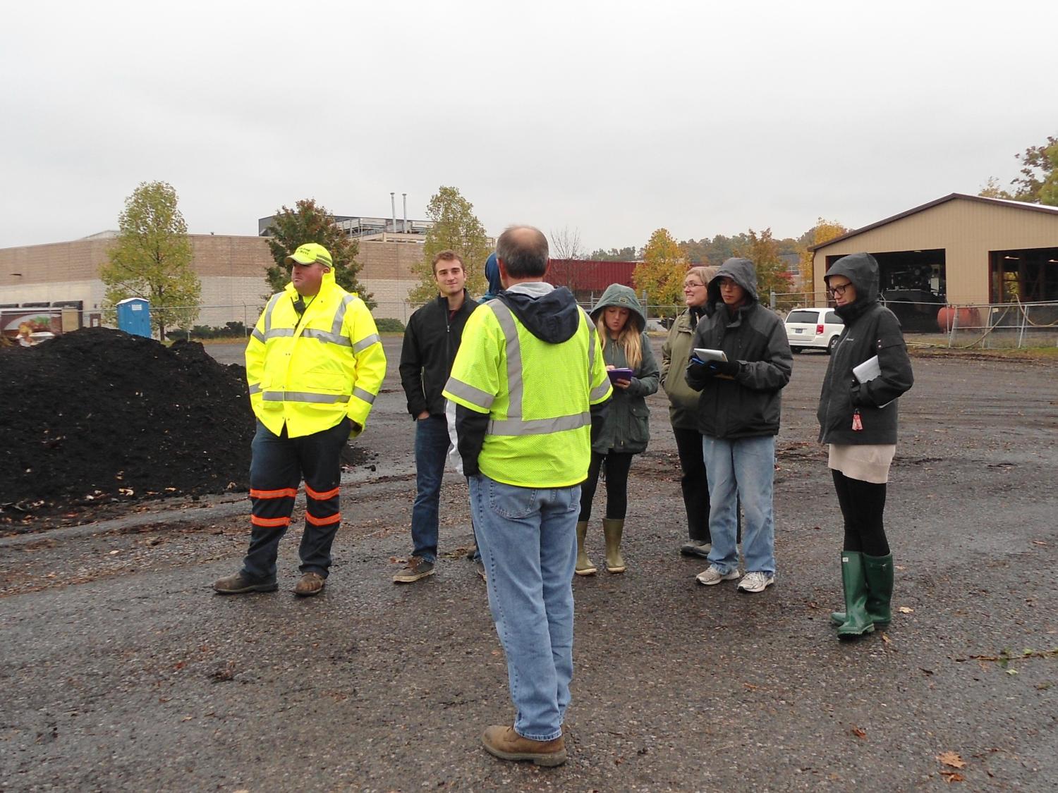 University Park students speak with facility managers at State College's compost facility