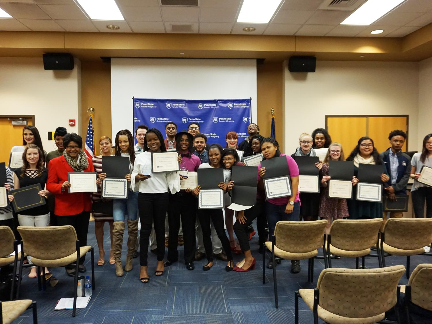 Honorees of the 2018 EPIC and Academic Achievement Awards Holding Awards.