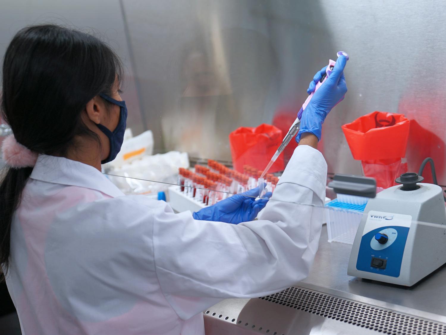 D4A student RA preparing blood samples for testing