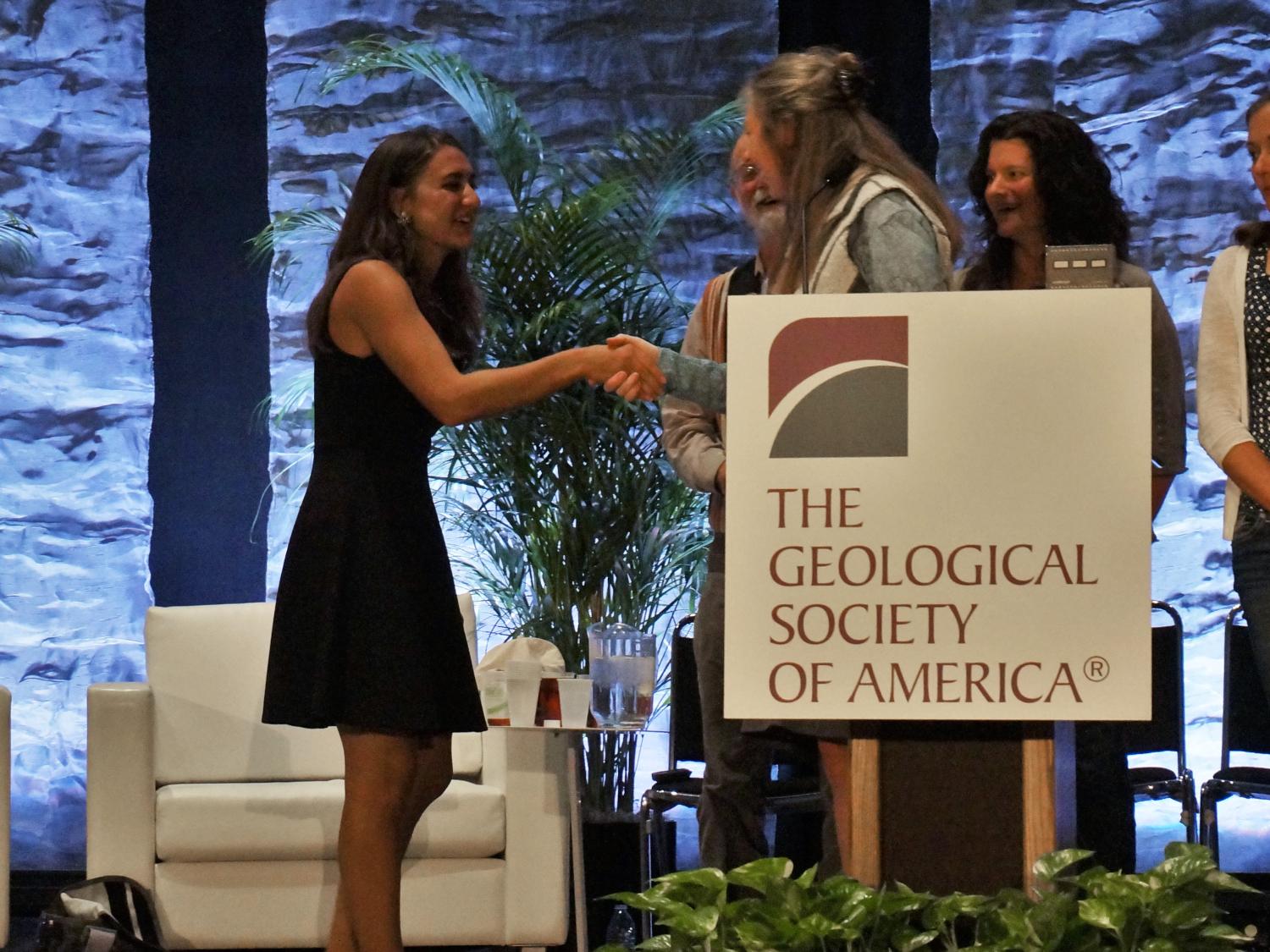 Penn State mater's student Joanmarie Del Vecchio accepts an award at the 2016 GSA meeting.