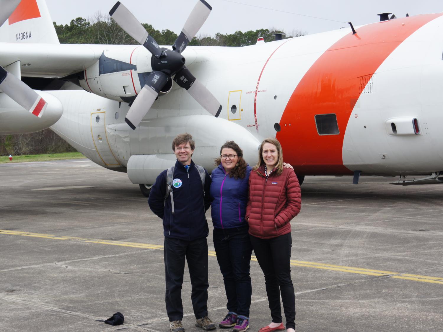Researchers stand in front of C-130 plane before ACT-America research flight