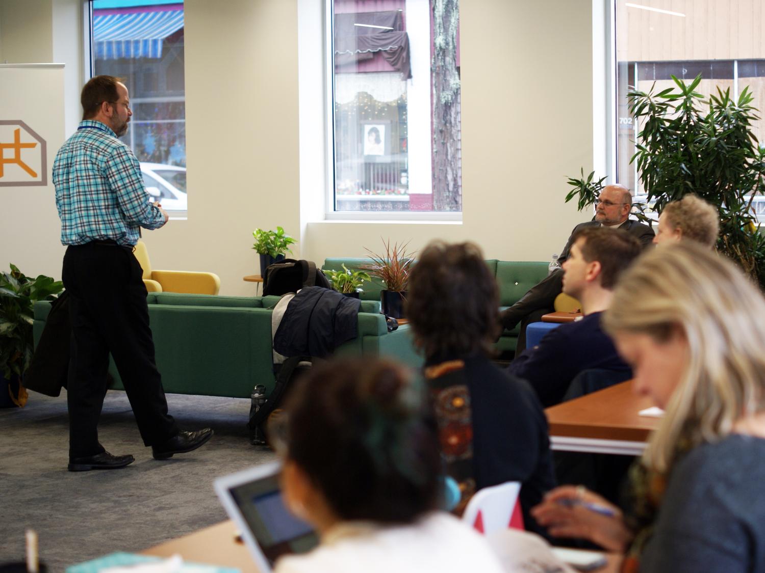 Faculty and staff listen to presentation