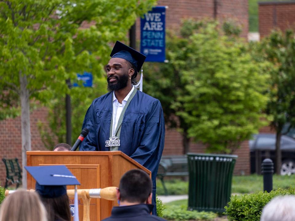 Donovan Verges speaking at podium at commencement 