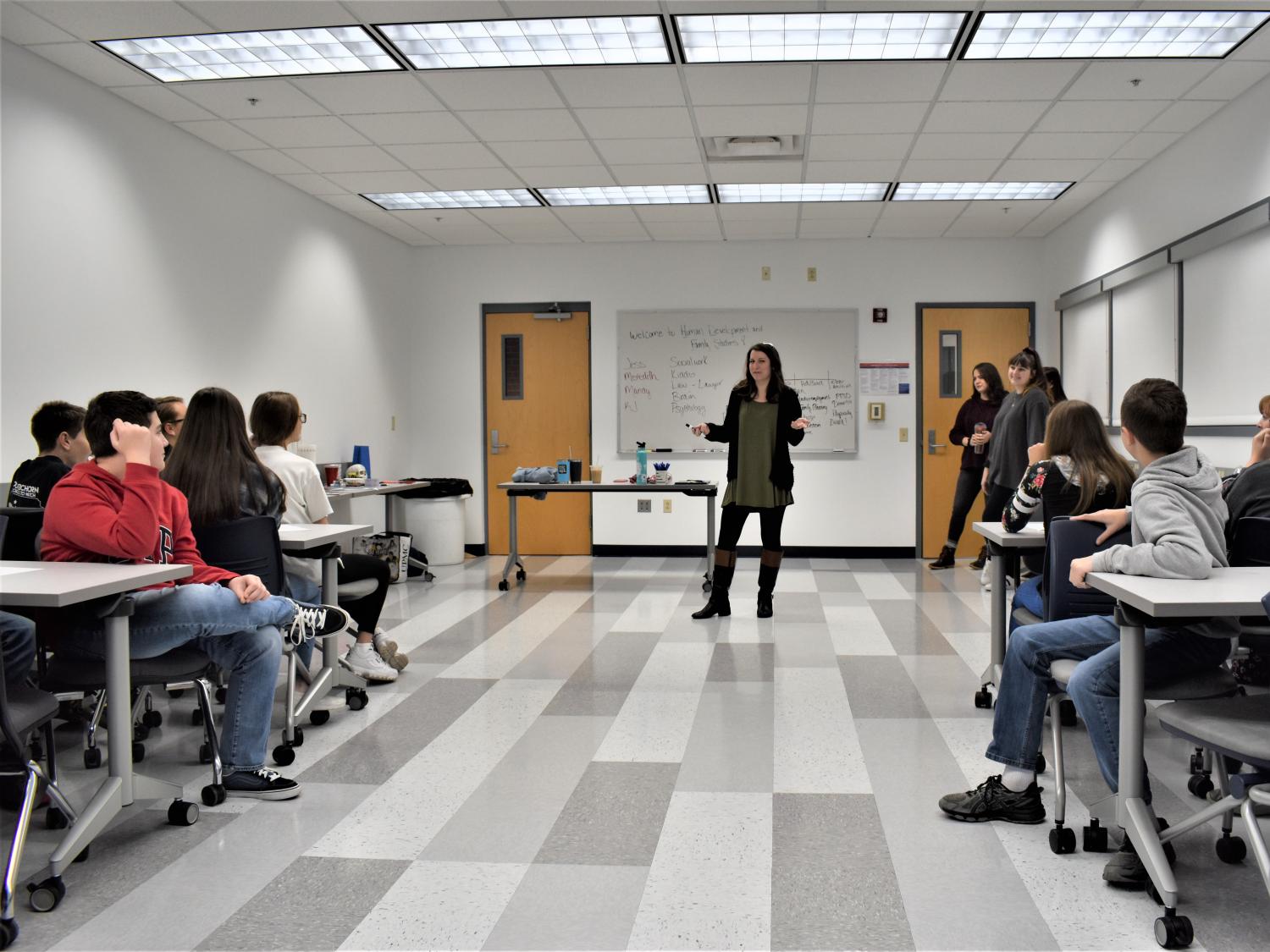 Lecturer in Human Development and Family Studies Jessica Clontz , at center, leads a workshop for students in gifted programs at area school districts. 