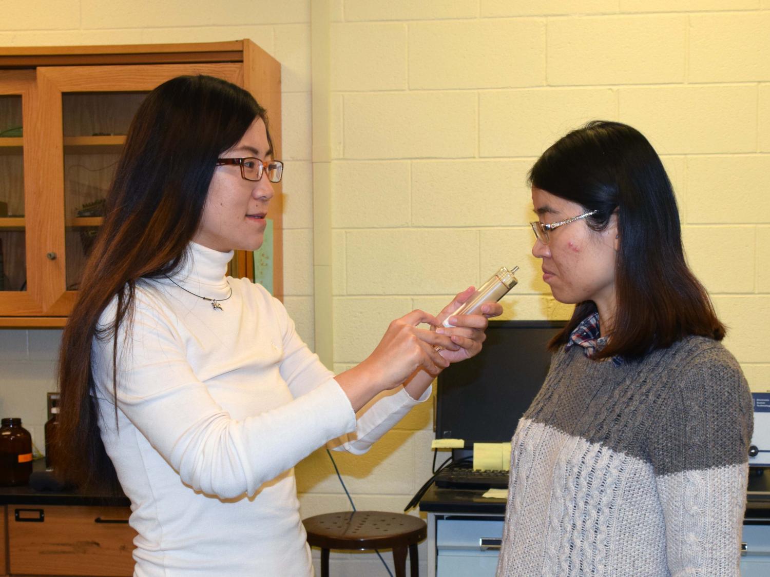 Fangle Chang Presenting a Scent Sample