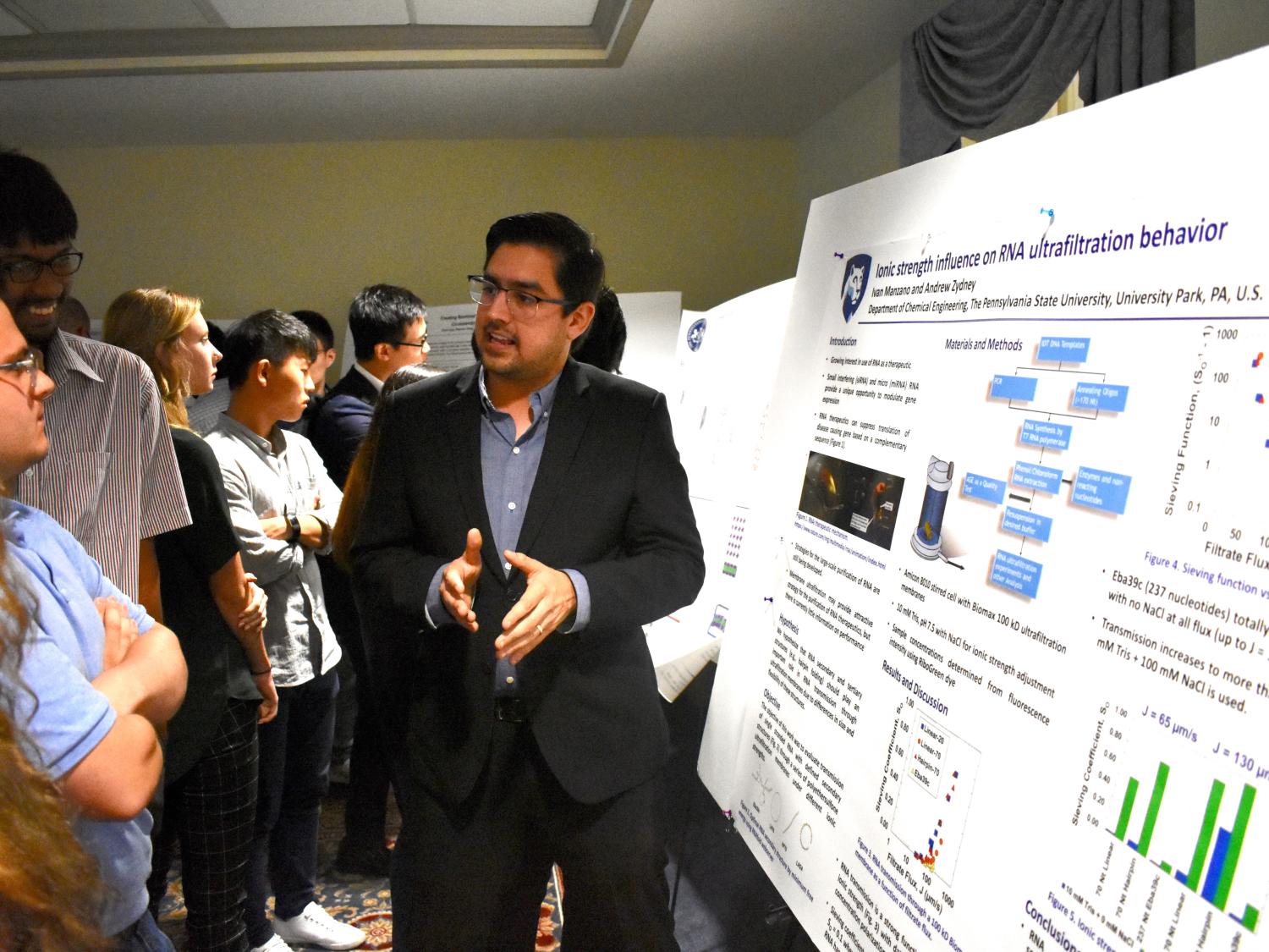 Presenter gestures during poster session with small group of people