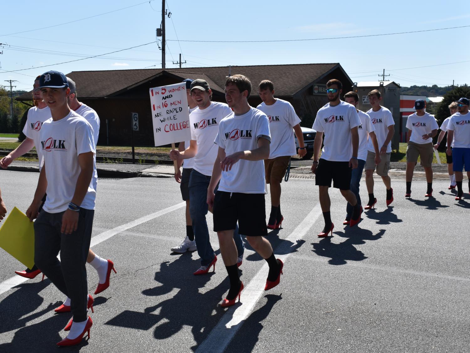 Men walking in high heals.