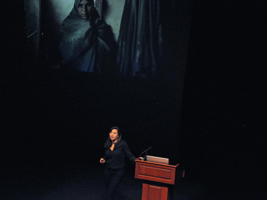 Photojournalist Lynsey Addario addresses the crowd in Schwab