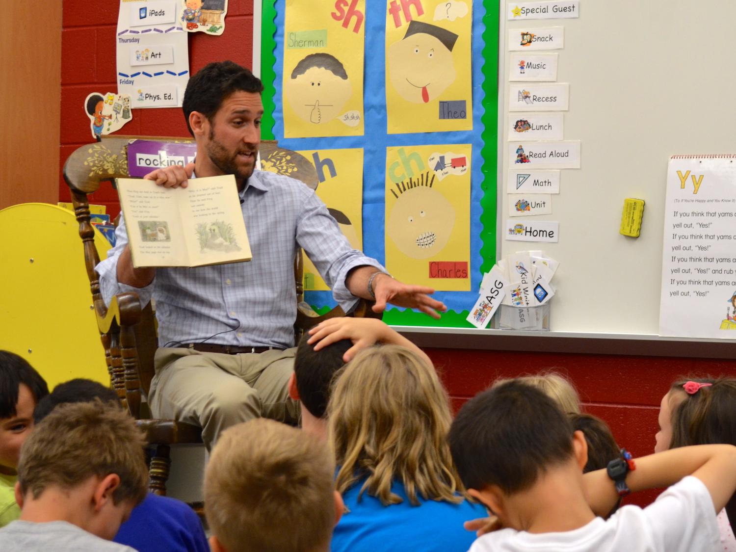 Michael Burroughs reads to children at Park Forest Elementary School