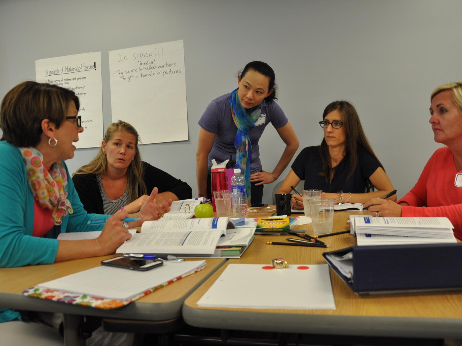 professor working with adult students