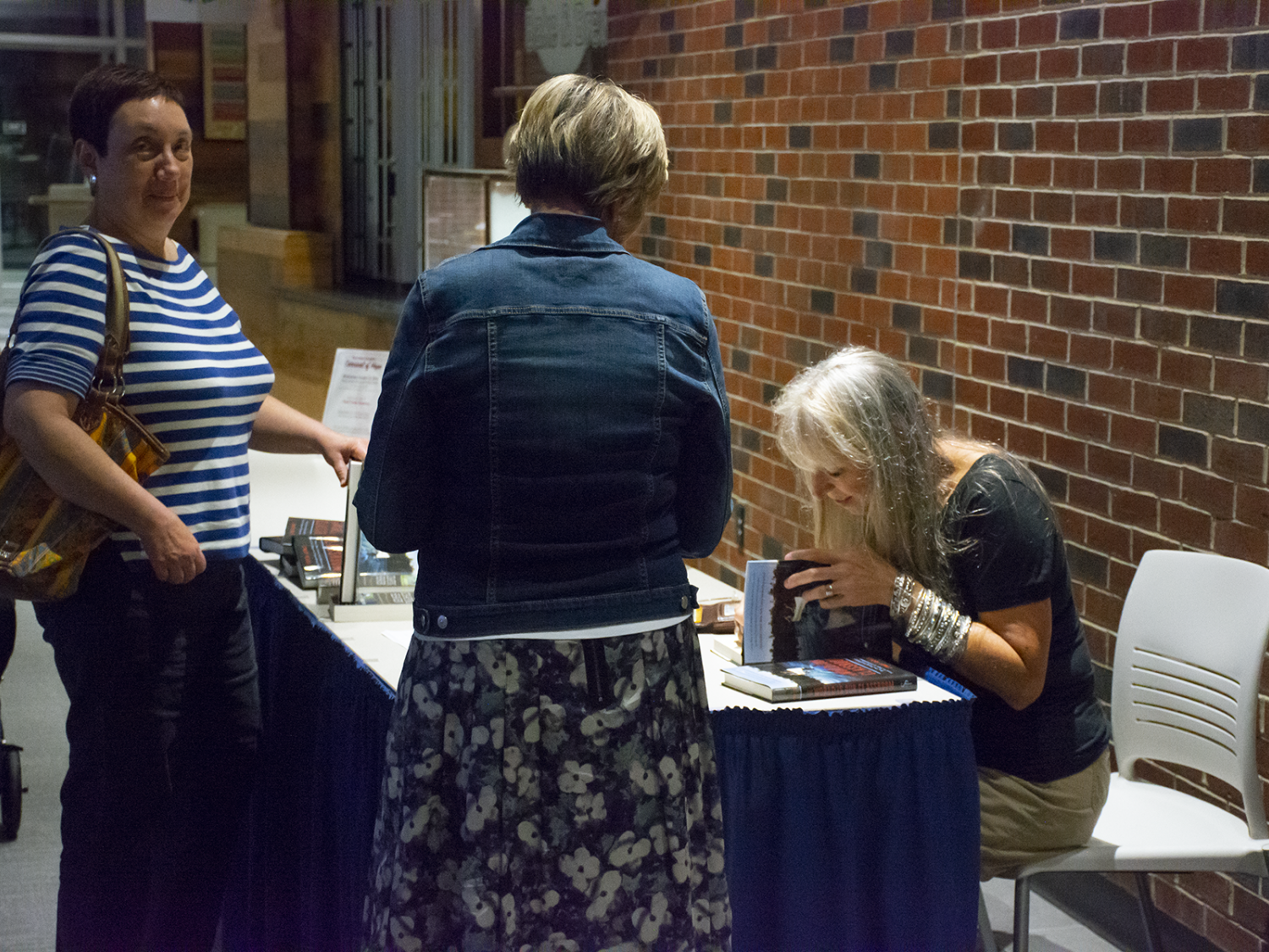 Cindy Ross signs books for waiting fans
