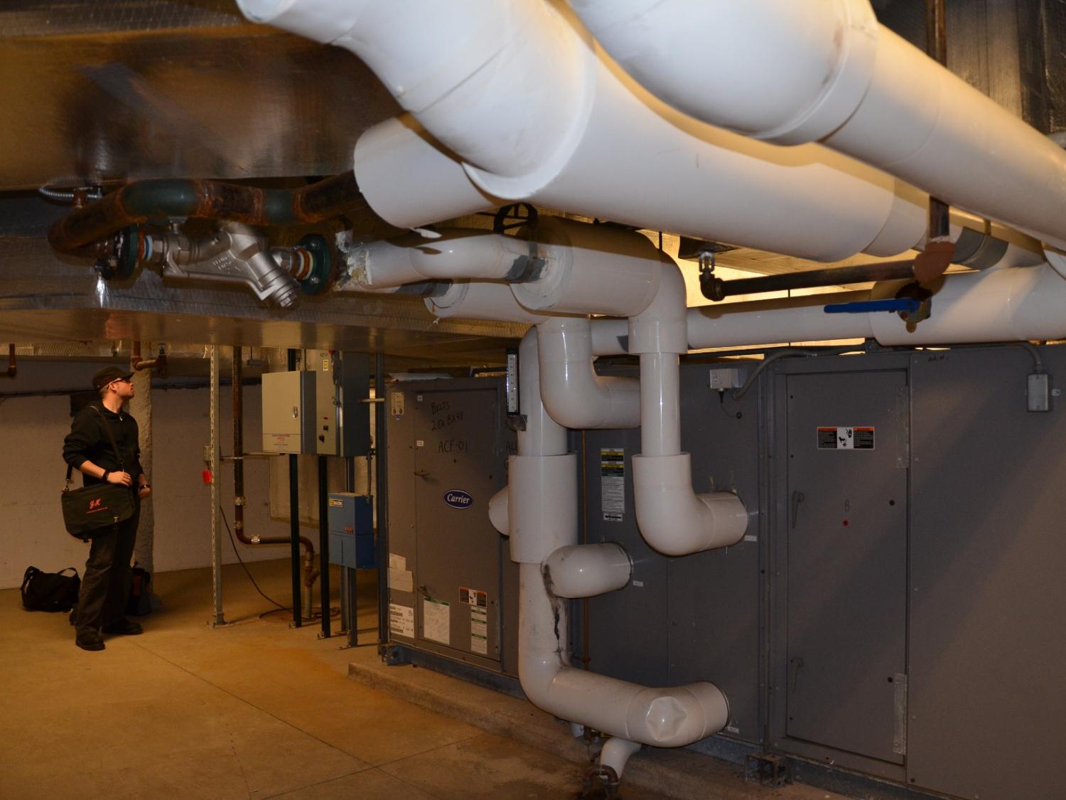 Joe Firrantello inspects an HVAC system