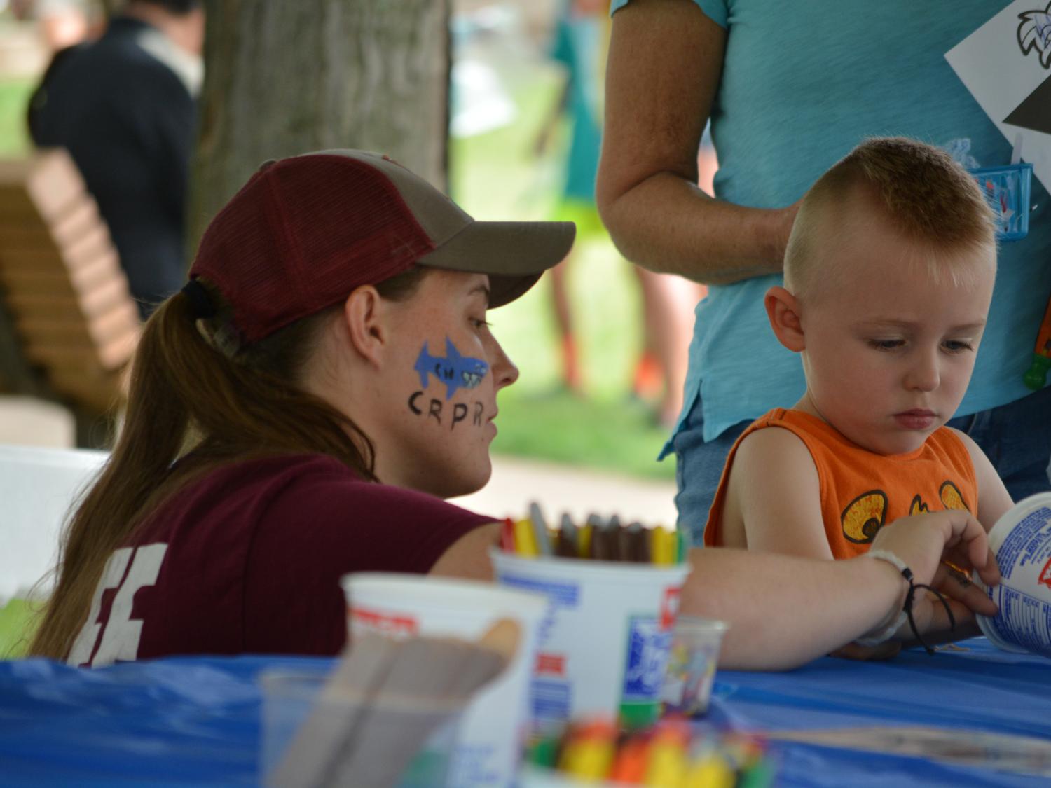 Kashia Quay working with child at Arts Fest