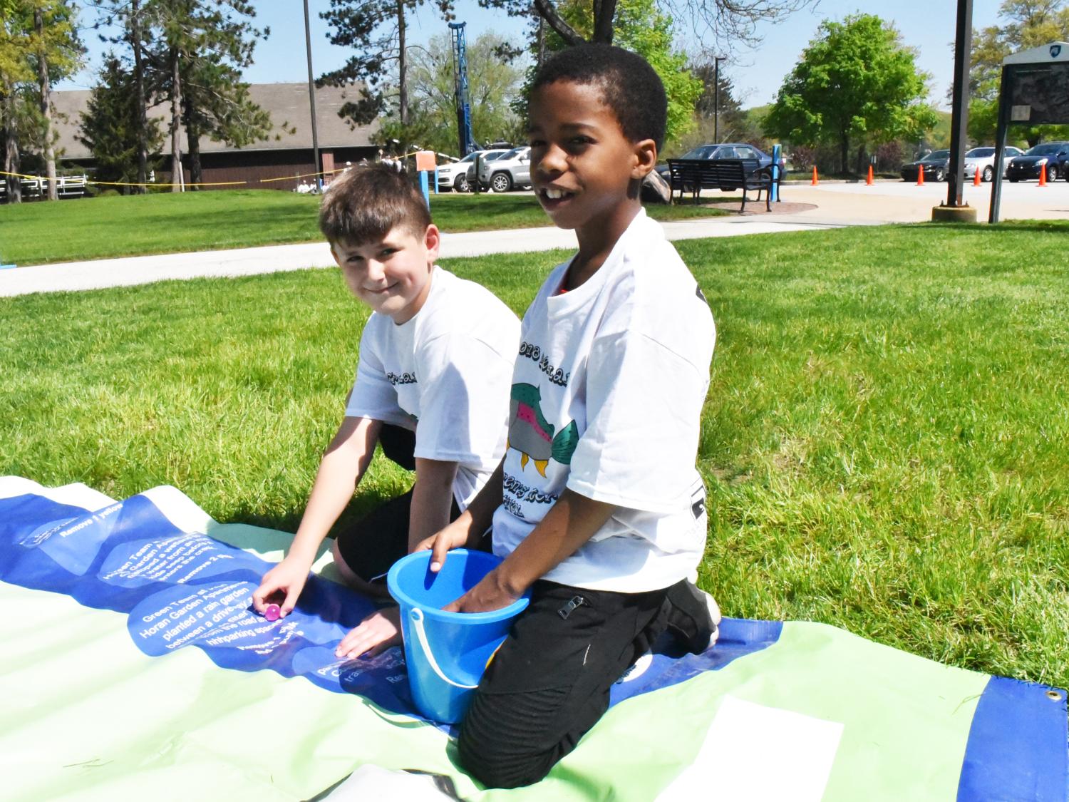 Amari Eaddy, right, and David Burdak participate in an Interactive Watershed Game at the Children's Water Festival, held May 17 at Penn State Behrend.