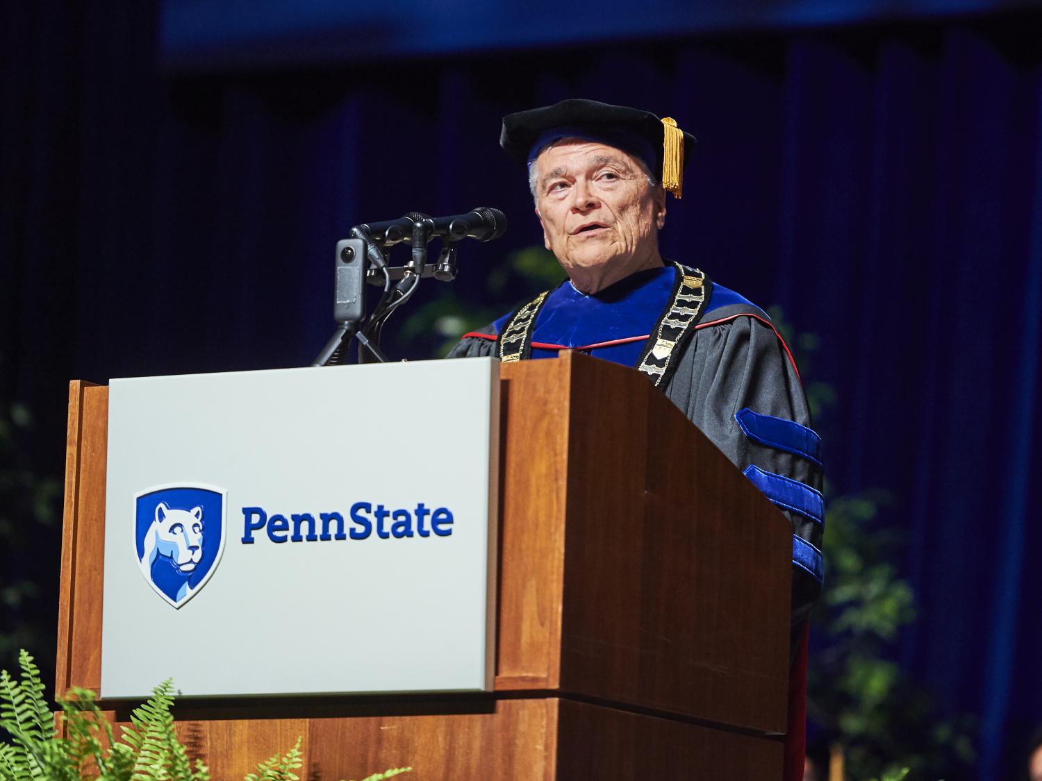 President Barron speaks from a podium.