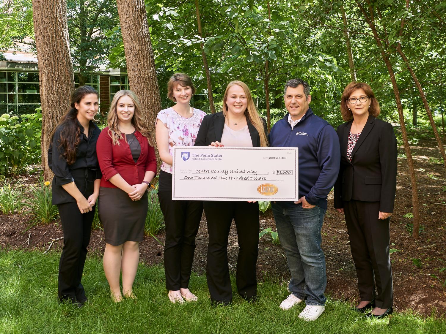 Marlena Karaky, Laura Sullivan, Wendy Vinhage, Chelsea Frantz, John Papazoglou, and Tracey Huston attend check presentation