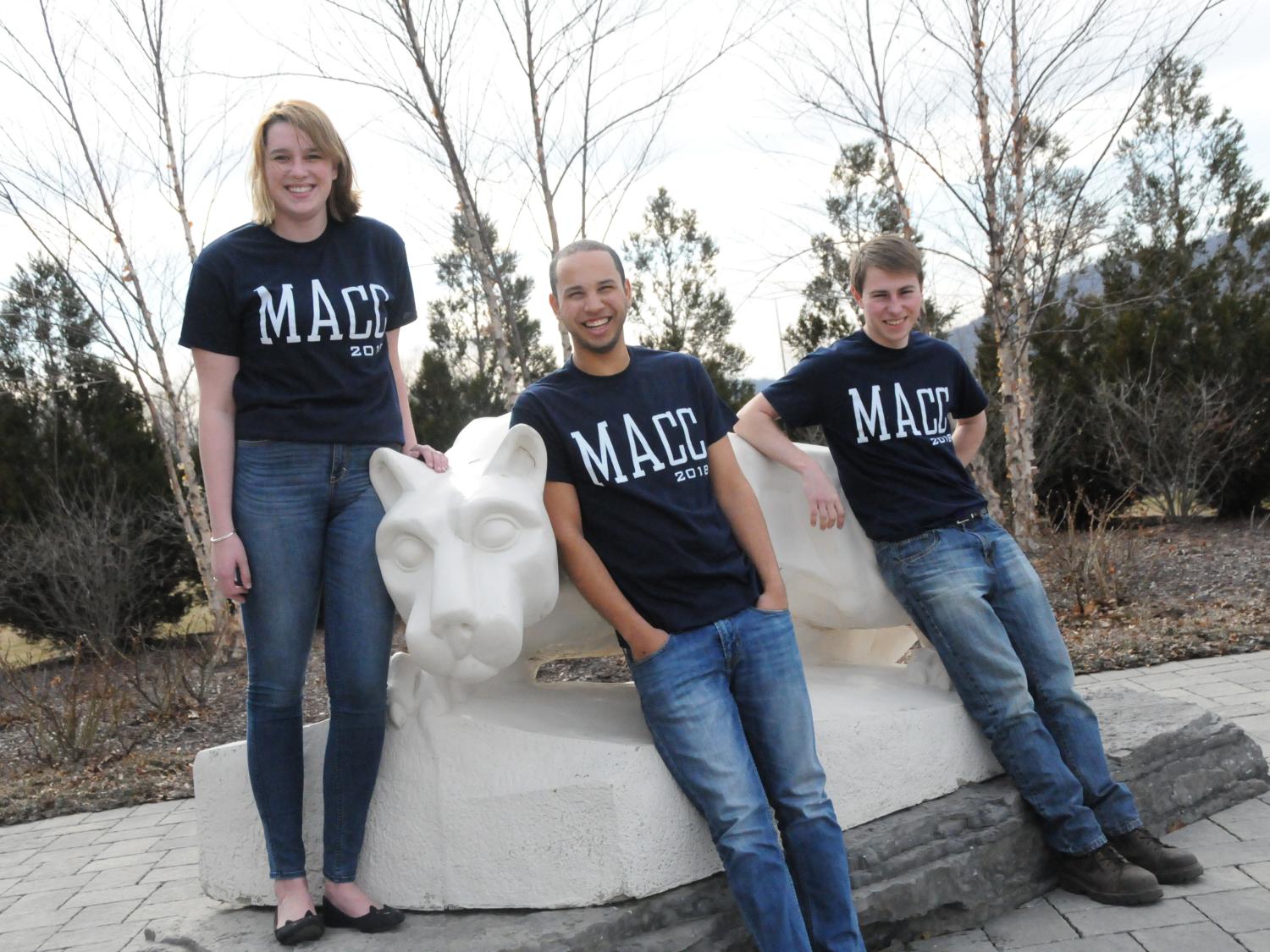 MAcc students pose with the Nittany Lion Shrine wearing their shirts