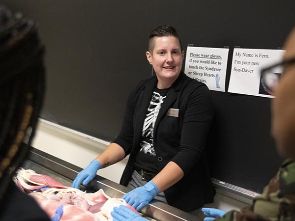 Katrina Porter, assistant teaching professor of biology, introduces the Syndaver, a simulated human cadaver used for study. 