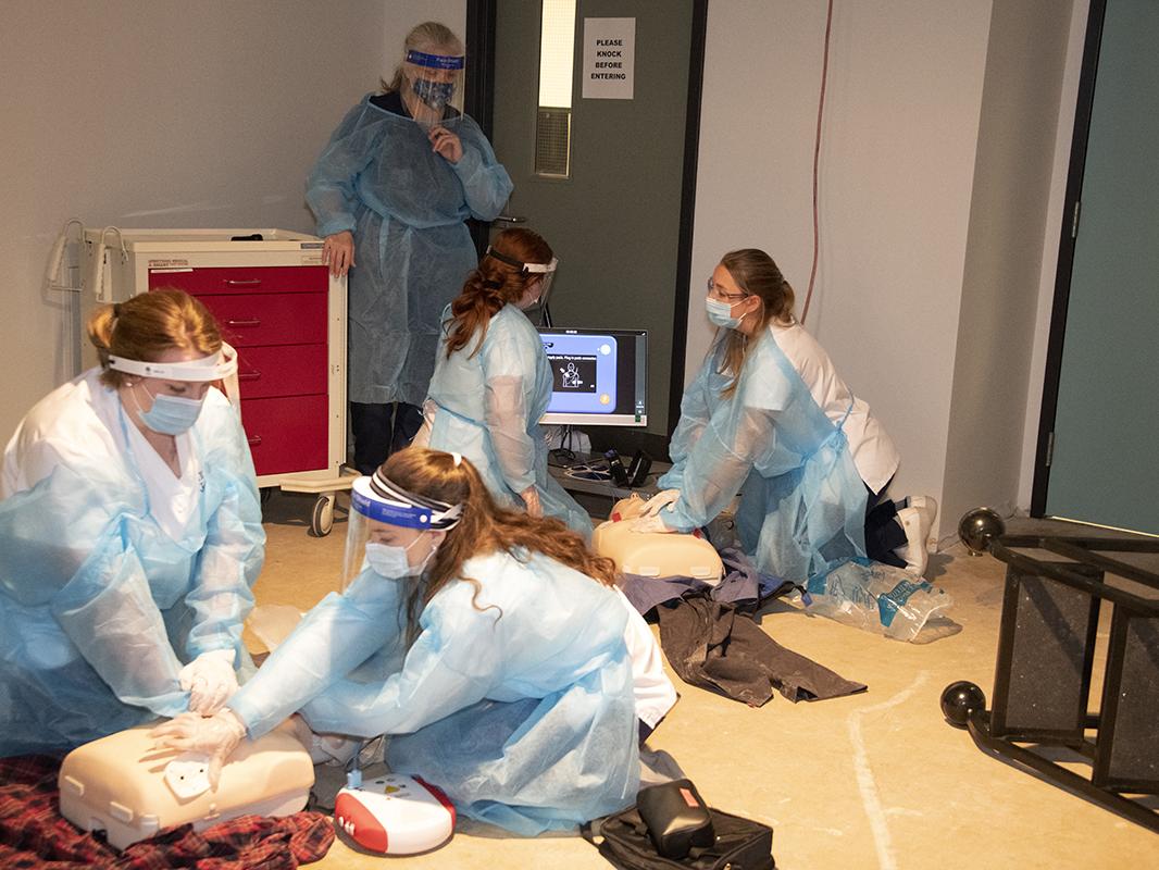 Four nursing students treat simulated patients in educational escape room