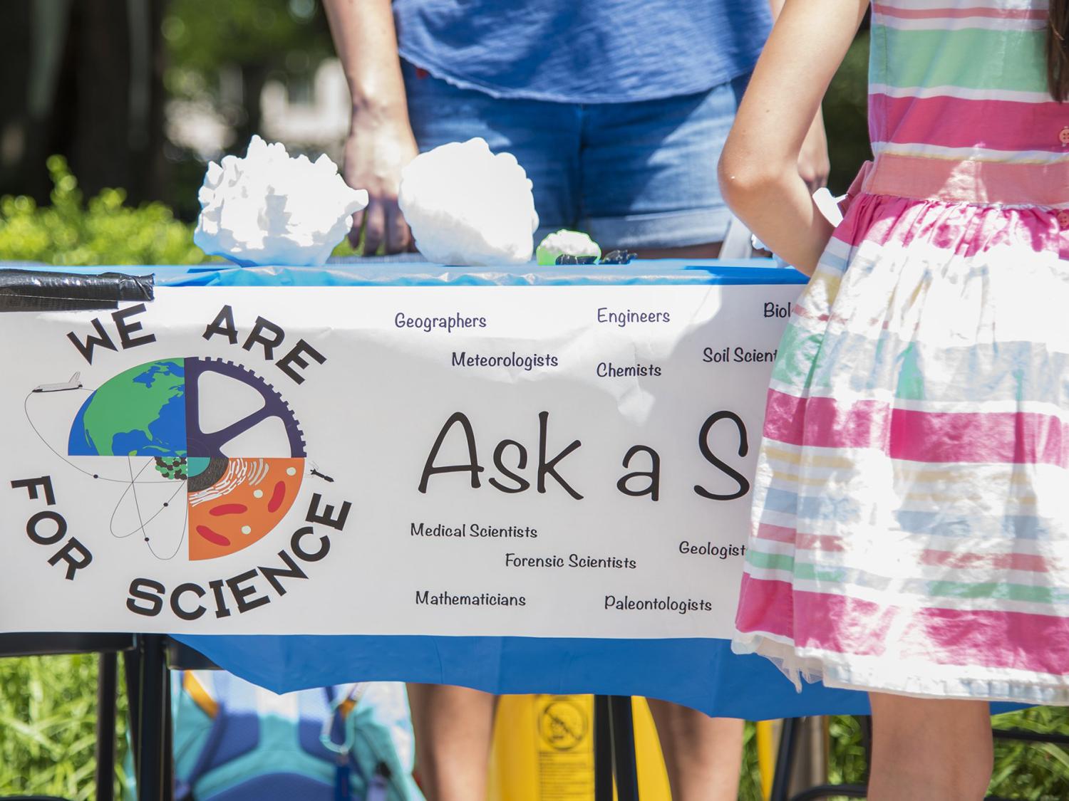 Members of WE ARE for Science host an Ask a Scientist booth at the Central Pennsylvania Festival of the Arts. 