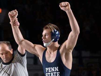 Penn State senior wrestler David Taylor raises his arms in victory after a win against Clarion