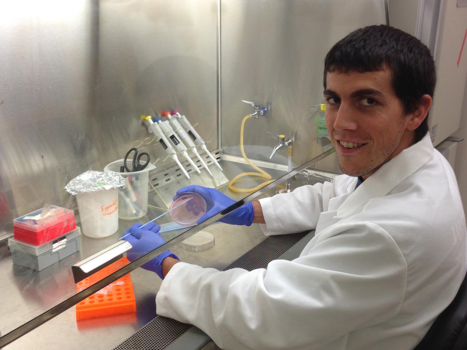 researcher at fume hood
