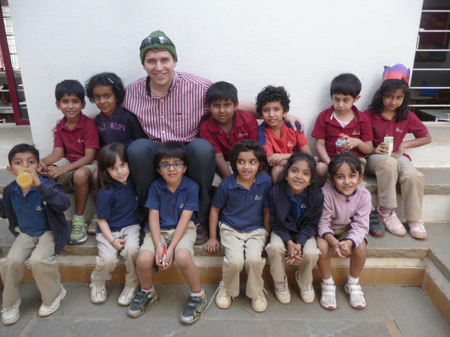 Secondary education student Drew DiSario poses with Indian students.