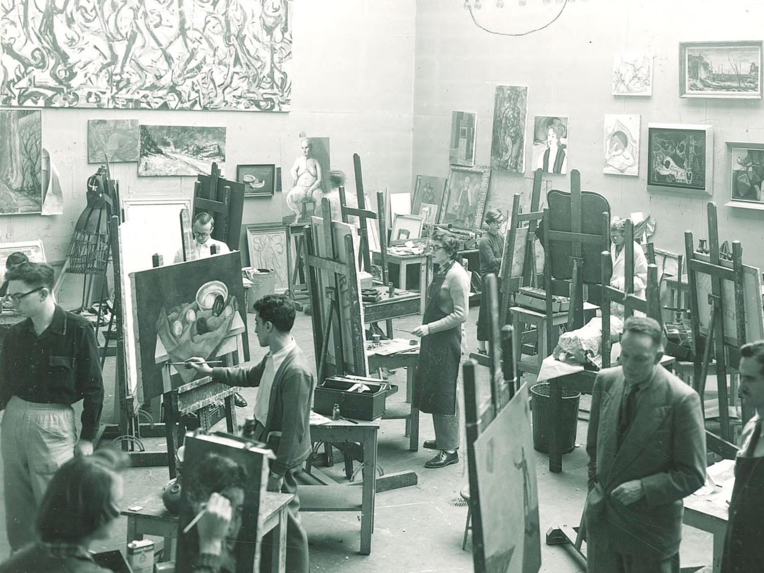 College students painting in large room in the 1950s