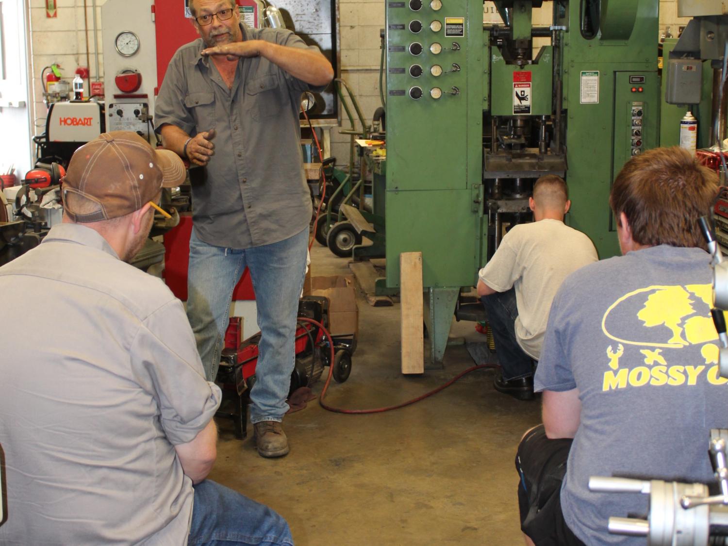 Students receive hands-on instruction on the shop floor.  