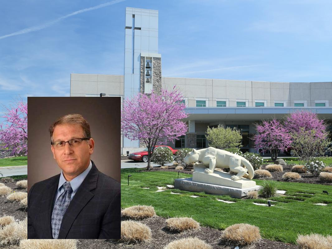 A photo of a man superimposed over a background of a hospital