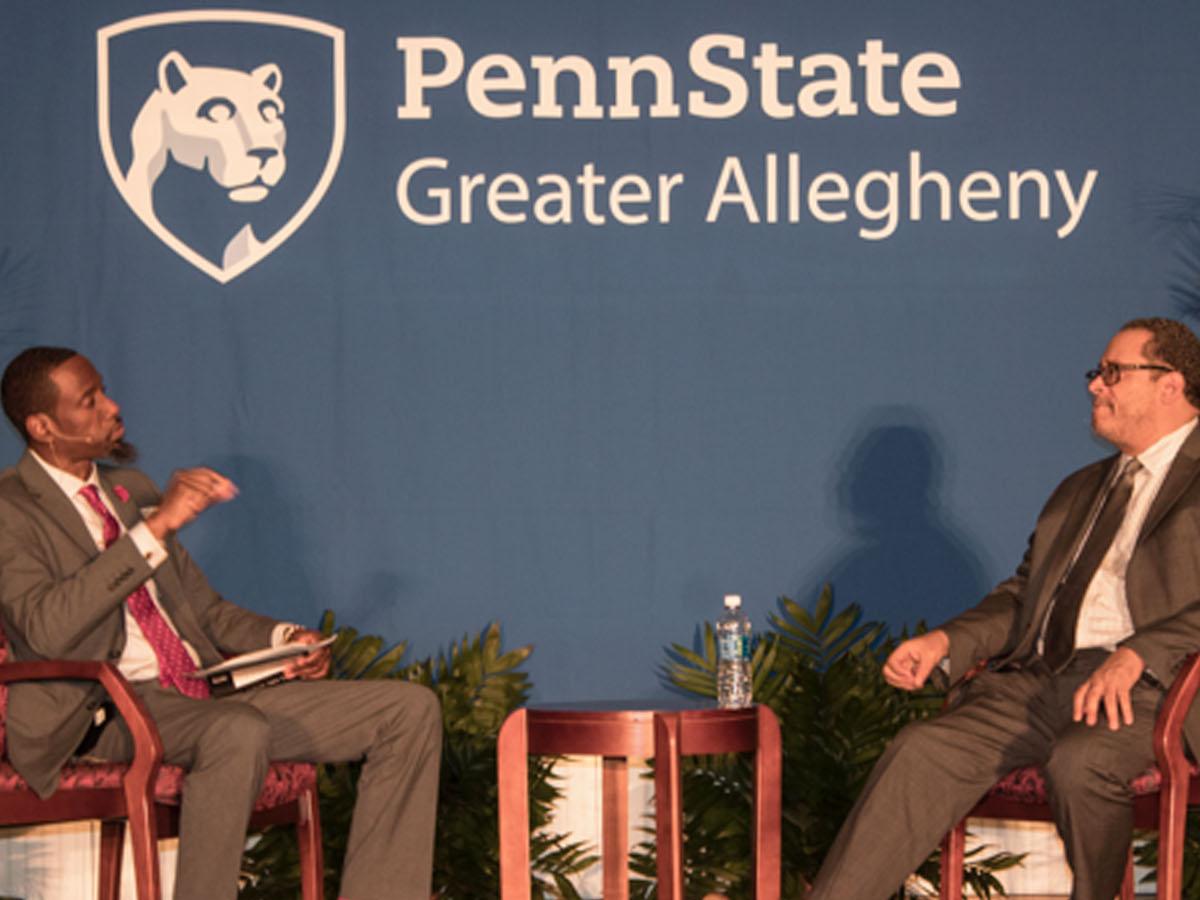 Johnathan White interviews Dr. Michael Eric Dyson on stage at Crossing Bridges: A Summit