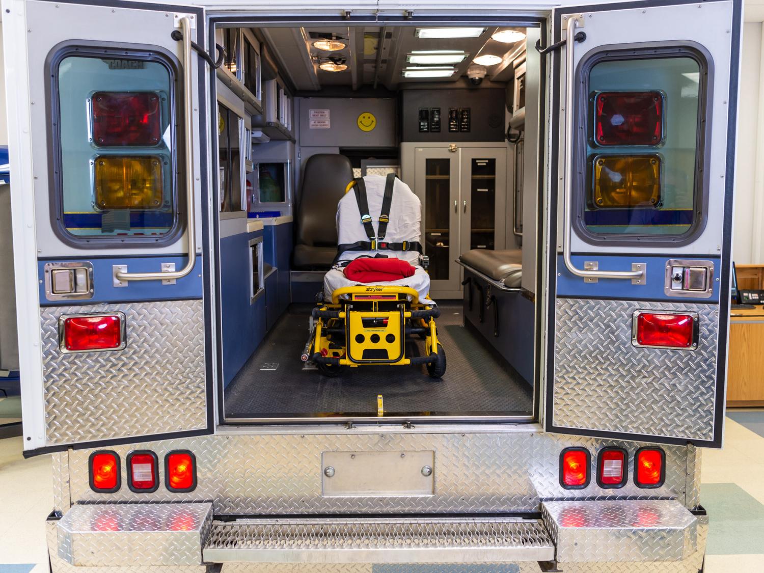 The back of an ambulance with the doors open