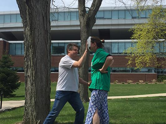 Marisa Ferger, lecturer in meteorology is hit with a pie for charity 