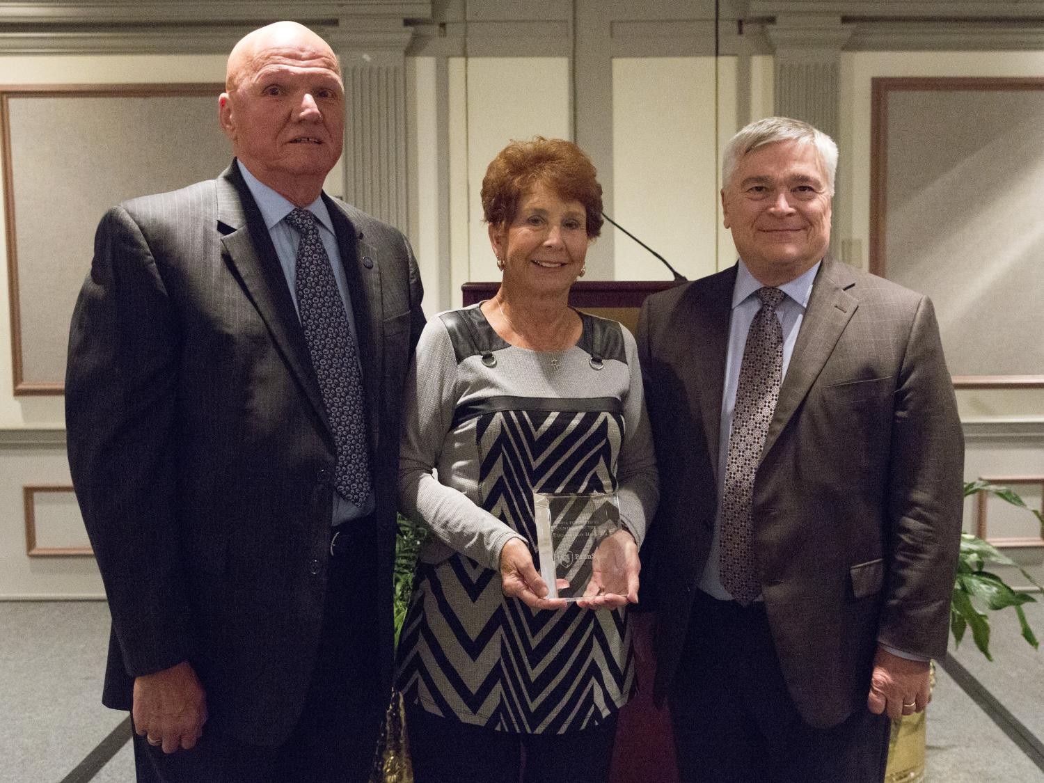 Earl and Kay Harbaugh with President Barron