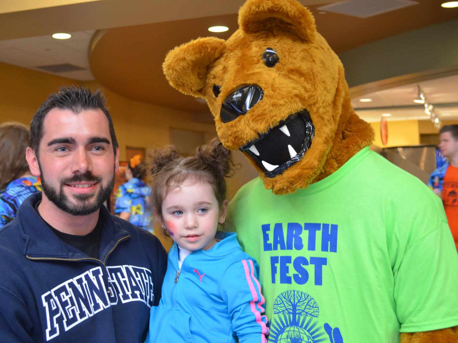 Shenango student Brandon Hunt enjoys Earth Fest 2014 with his daughter and the Nittany Lion.