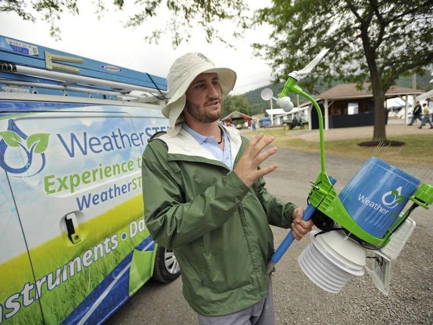 graduate student explains weather station