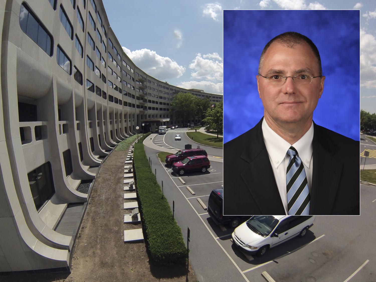 A photo of a man smiling superimposed over a photo of Hershey Medical Center campus