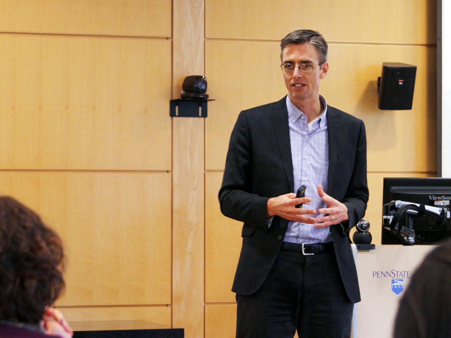 Erik Foley speaking at a luncheon