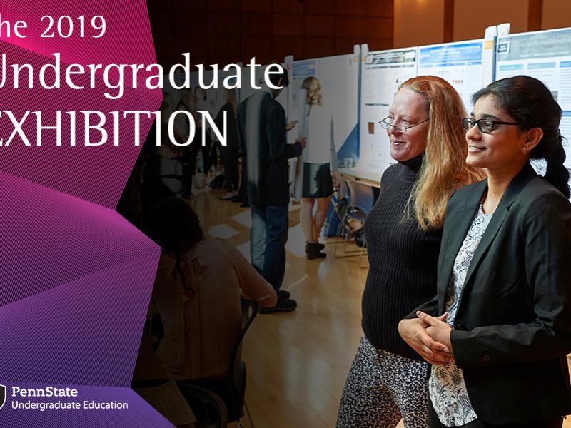 Judges view student posters at the Undergraduate Exhibition